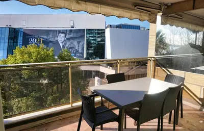 a table and chairs on a balcony with a view at Ref LEM4 - Palmes d'Or Properties in Cannes