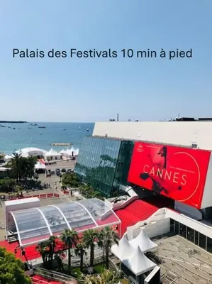 a building on the beach with the ocean in the background at Lumineux Studio TERRASSE, Rouaze-MARTINEZ CARLTON A0B132 in Cannes