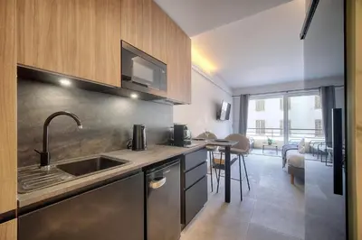 a kitchen with a sink and a counter top at Cannes Luxury Rental - Stunning apartment with terrace to rent Grand Hotel in Cannes