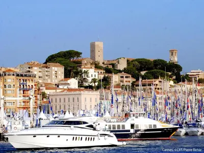 two boats are docked in a harbor with a city at Apartment Villa Francia-6 by Interhome in Cannes