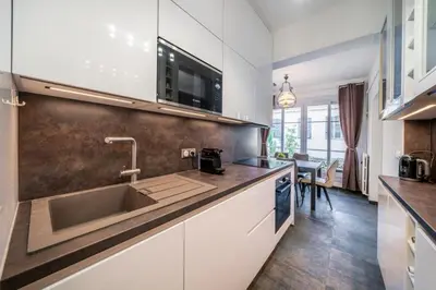 a kitchen with a sink and a counter top at Brand new 2 bedrooms heart of Cannes in Cannes