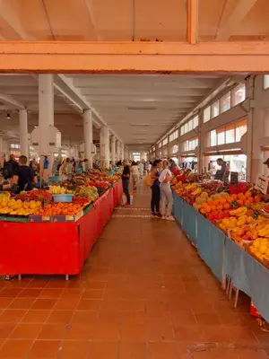 a market with many tables filled with fruits and vegetables at FORVILLE APARTMENT Cannes in Cannes