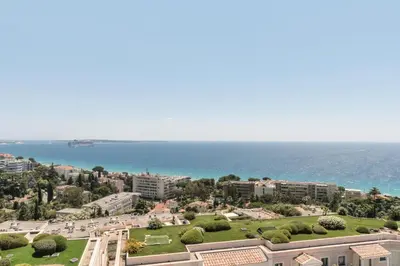 a view of a city with the ocean in the background at Résidence Cannes Villa Francia - maeva Home - Appartement 3 pièces 7 personnes - Sélection MAE-0244 in Cannes