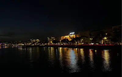 a city at night with lights on the water at 1 Bedroom Gorgeous Apartment In Cannes in Cannes