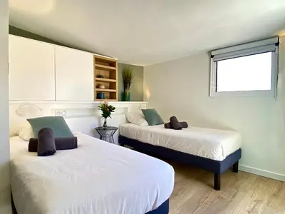 a room with two beds and a window at Duplex Luxury Toîts du Soleil By SCLS Locations in Cannes