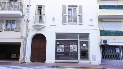 a white building with a door and a window at Proche Carlton & Croisette, Appartement 103 in Cannes
