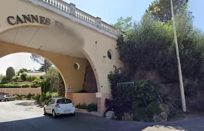 a car parked in a parking lot in front of a building at Le Delacroix By SCLS Locations in Cannes
