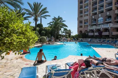 a group of people in a swimming pool at a hotel at Résidence Cannes Verrerie - maeva Home - Appartement climatisé 2 pièces 4 personnes - Sélection MAE-2064 in Cannes