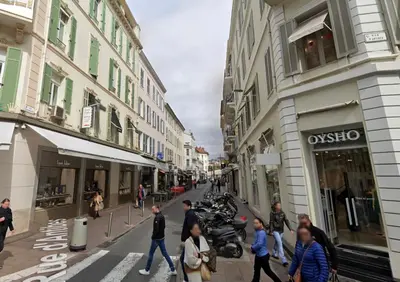 a group of people walking down a city street at Mini Studio - Le Chabaud - Cannes centre in Cannes