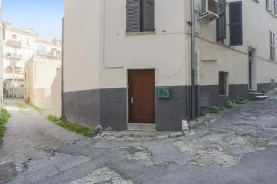 a building with a door on the side of a street at Studio Mimosa - Welkeys in Cannes