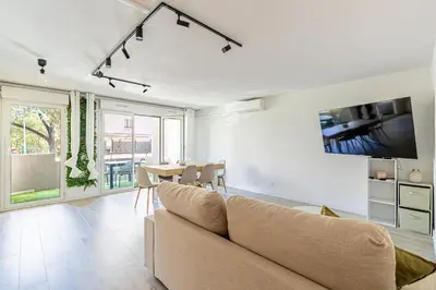 a living room with a couch and a table at Montfleury cannes in Cannes